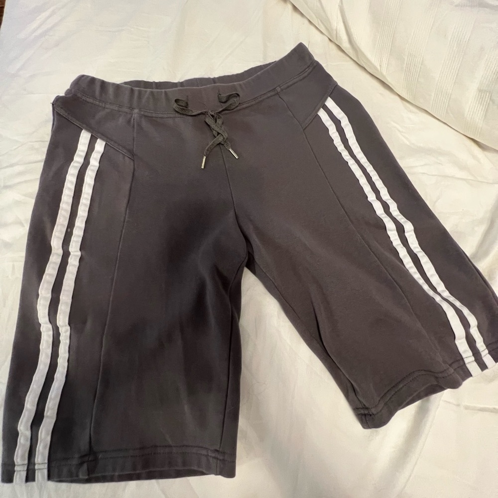 CW sport shorts elastic waist size medium. Color gray with white stripes on legs